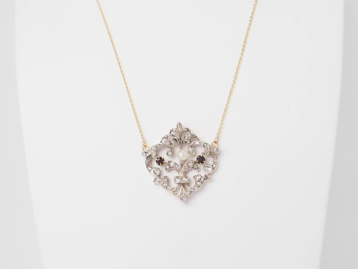 Collier volutes en or jaune et argent, grenat diamants et perle - Castafiore
