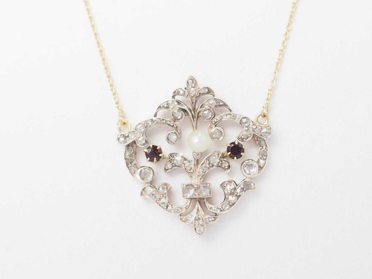 Collier volutes en or jaune et argent, grenat diamants et perle - Castafiore