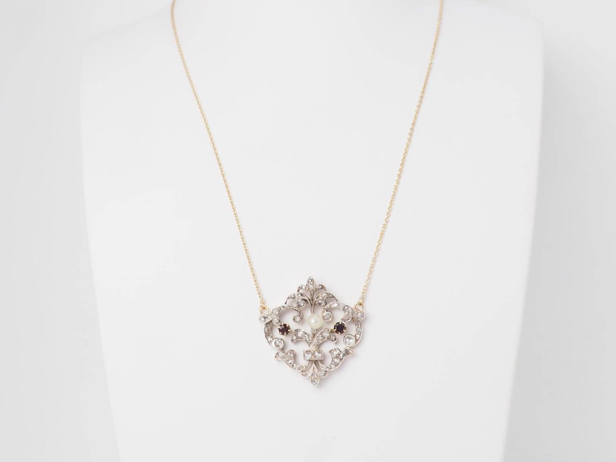 Collier volutes en or jaune et argent, grenat diamants et perle - Castafiore