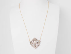 Collier volutes en or jaune et argent, grenat diamants et perle - Castafiore