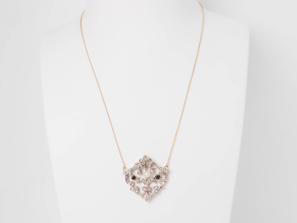 Collier volutes en or jaune et argent, grenat diamants et perle - Castafiore