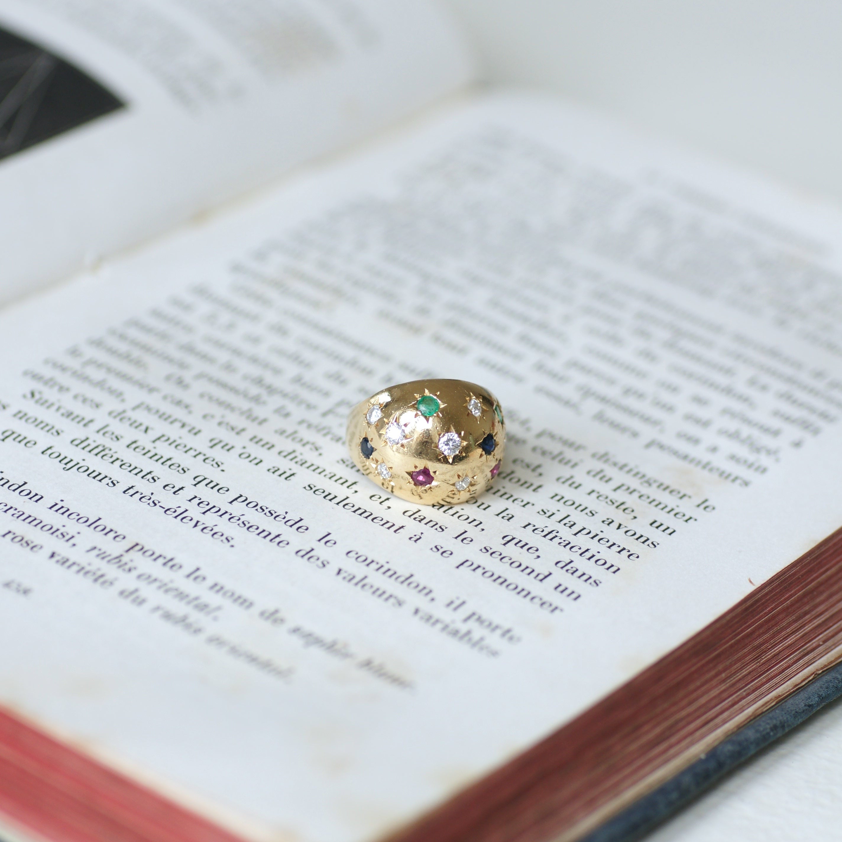 Ring in yellow gold, sapphires, emeralds, rubies, and diamonds