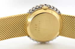 CHOPARD watch, Ref. 810, 18-carat yellow gold and diamonds, solid gold integrated bracelet, circa 1980.