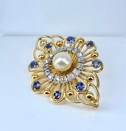 Gold brooch with sapphires, a pearl, and diamonds