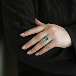 Entourage Ring in white gold, yellow gold, Emerald, and Diamonds