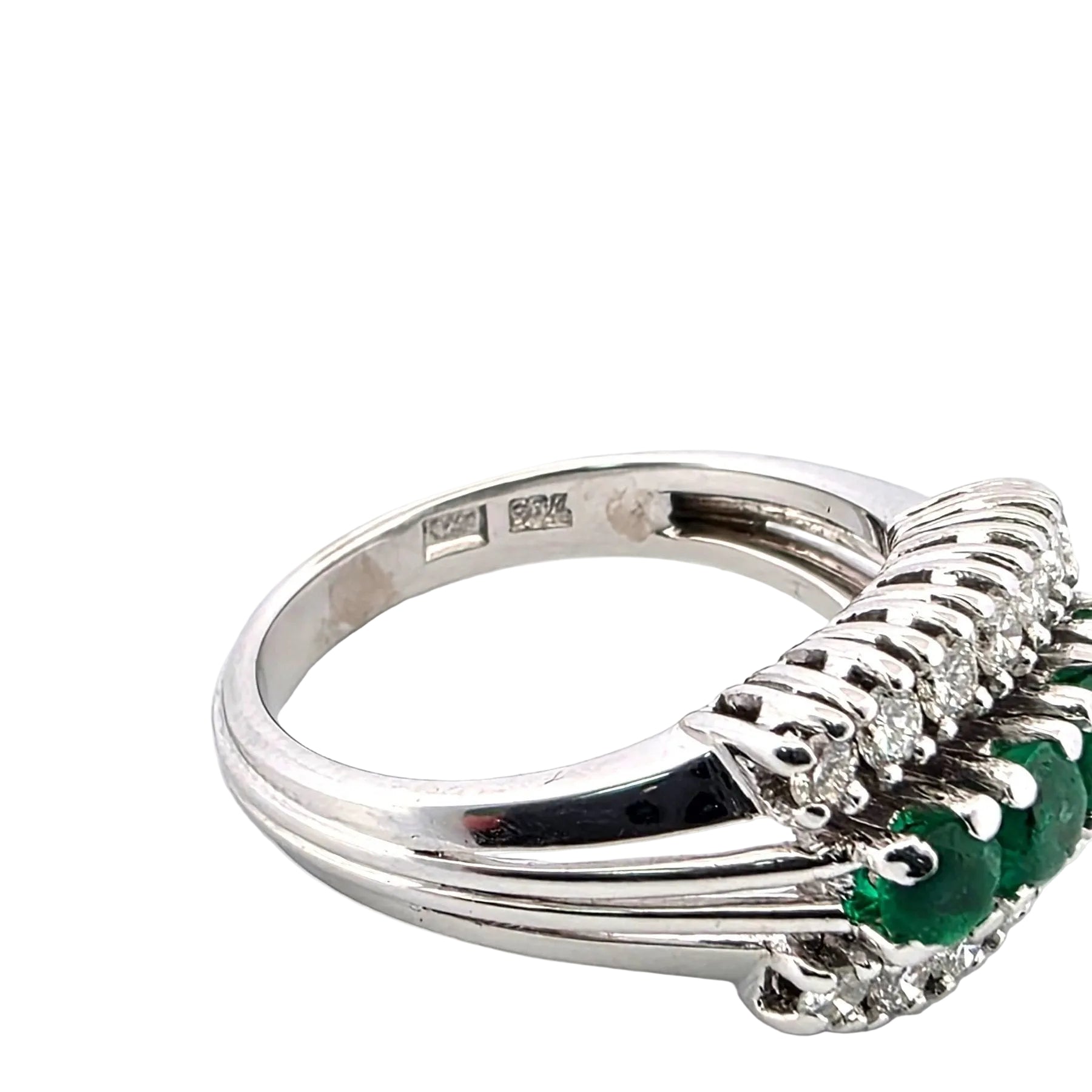 White gold ring with emeralds and diamonds