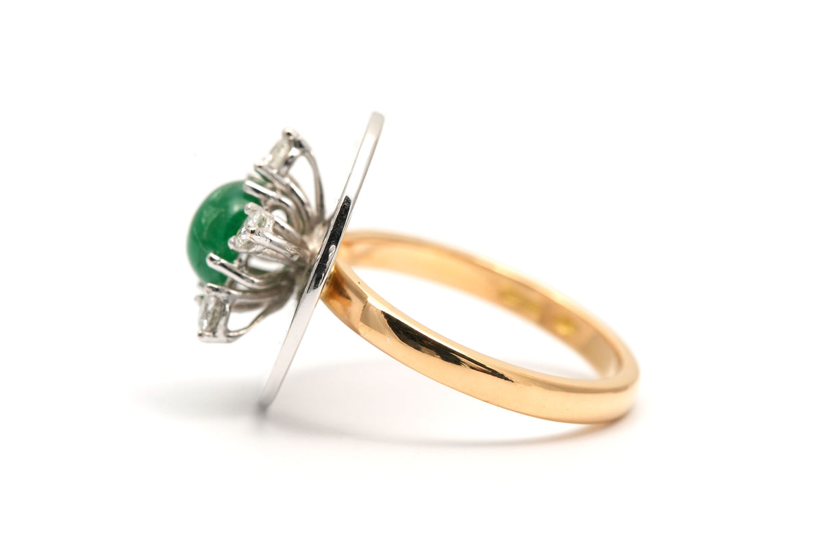 Ring in white gold, yellow gold, emeralds, and diamonds