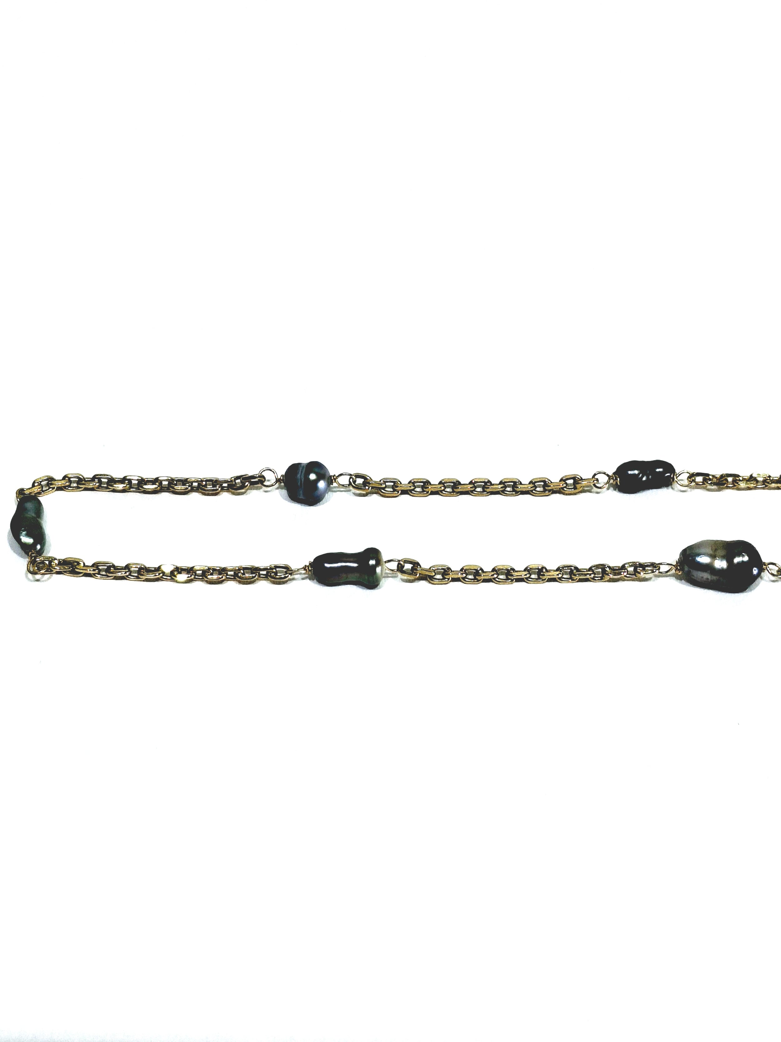 Rose gold long necklace with Tahitian pearls.