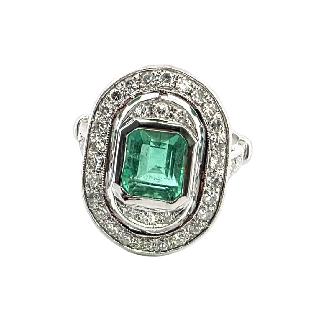 "Entourage" Ring in White Gold, Emerald, and Diamonds