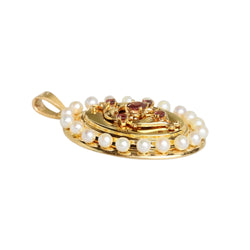 Pendentif en or jaune, perles et grenats