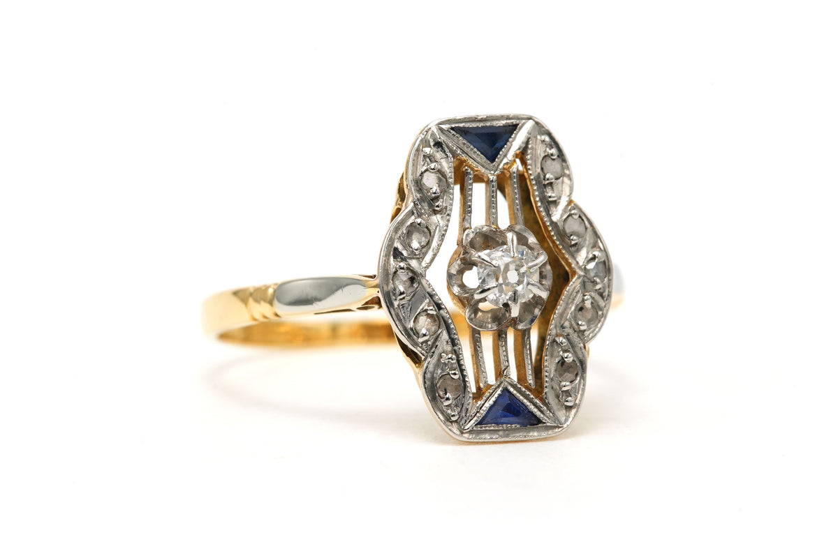 Ring in white gold, yellow gold, sapphires, and diamonds