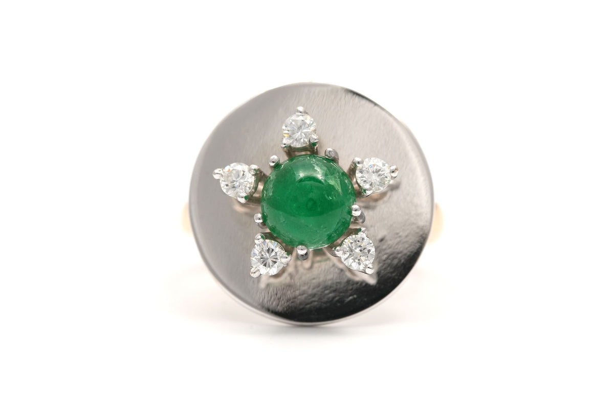 Ring in white gold, yellow gold, emeralds, and diamonds