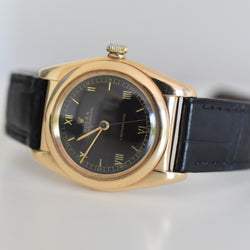 ROLEX "Oyster Perpetual Bubbleback Ovetto" watch in yellow gold and leather