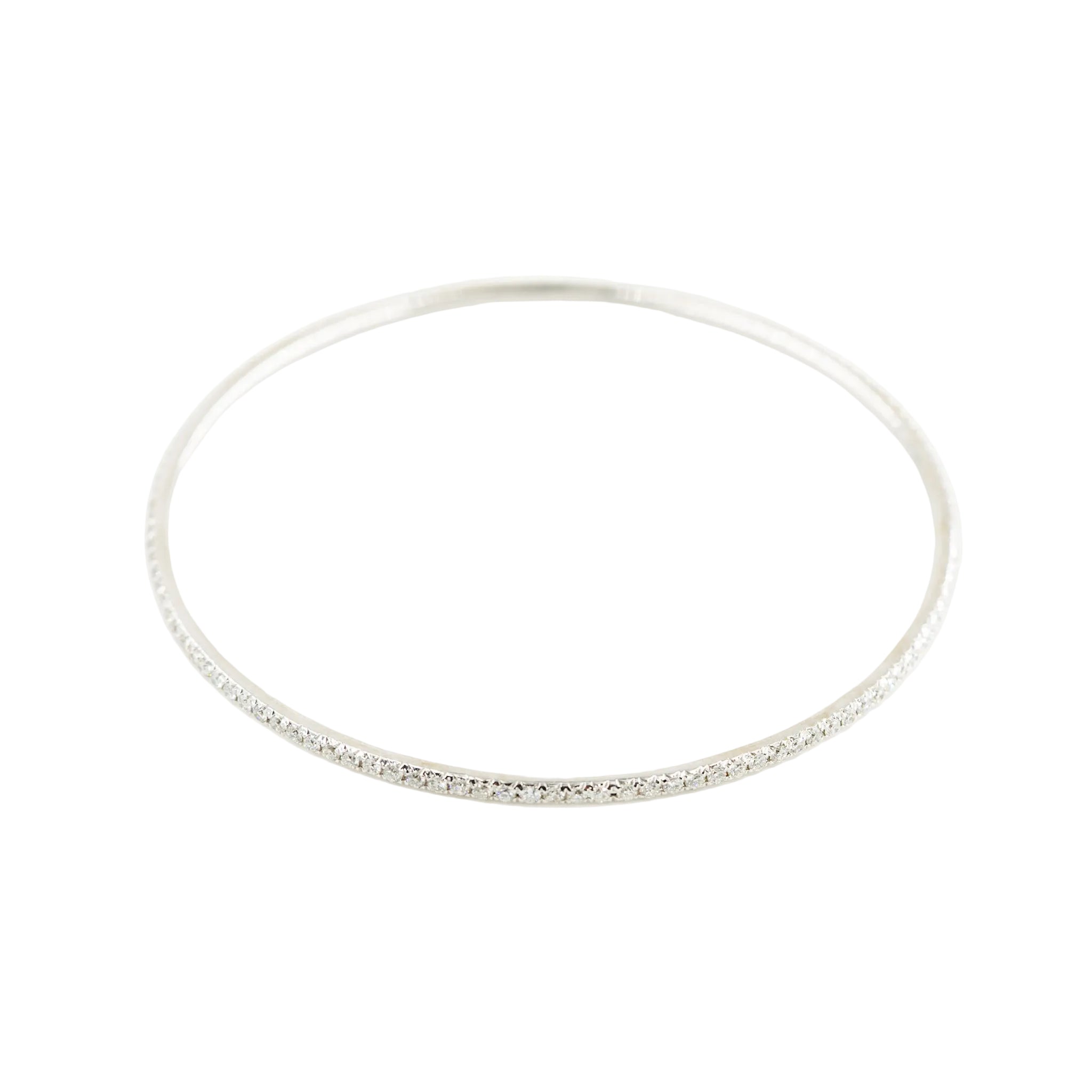 Three bangle bracelets in white gold, yellow gold, rose gold, and diamonds