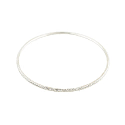 Three bangle bracelets in white gold, yellow gold, rose gold, and diamonds