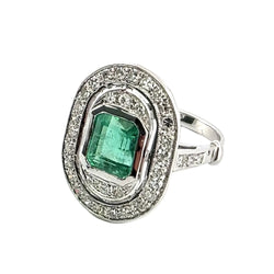 "Entourage" Ring in White Gold, Emerald, and Diamonds