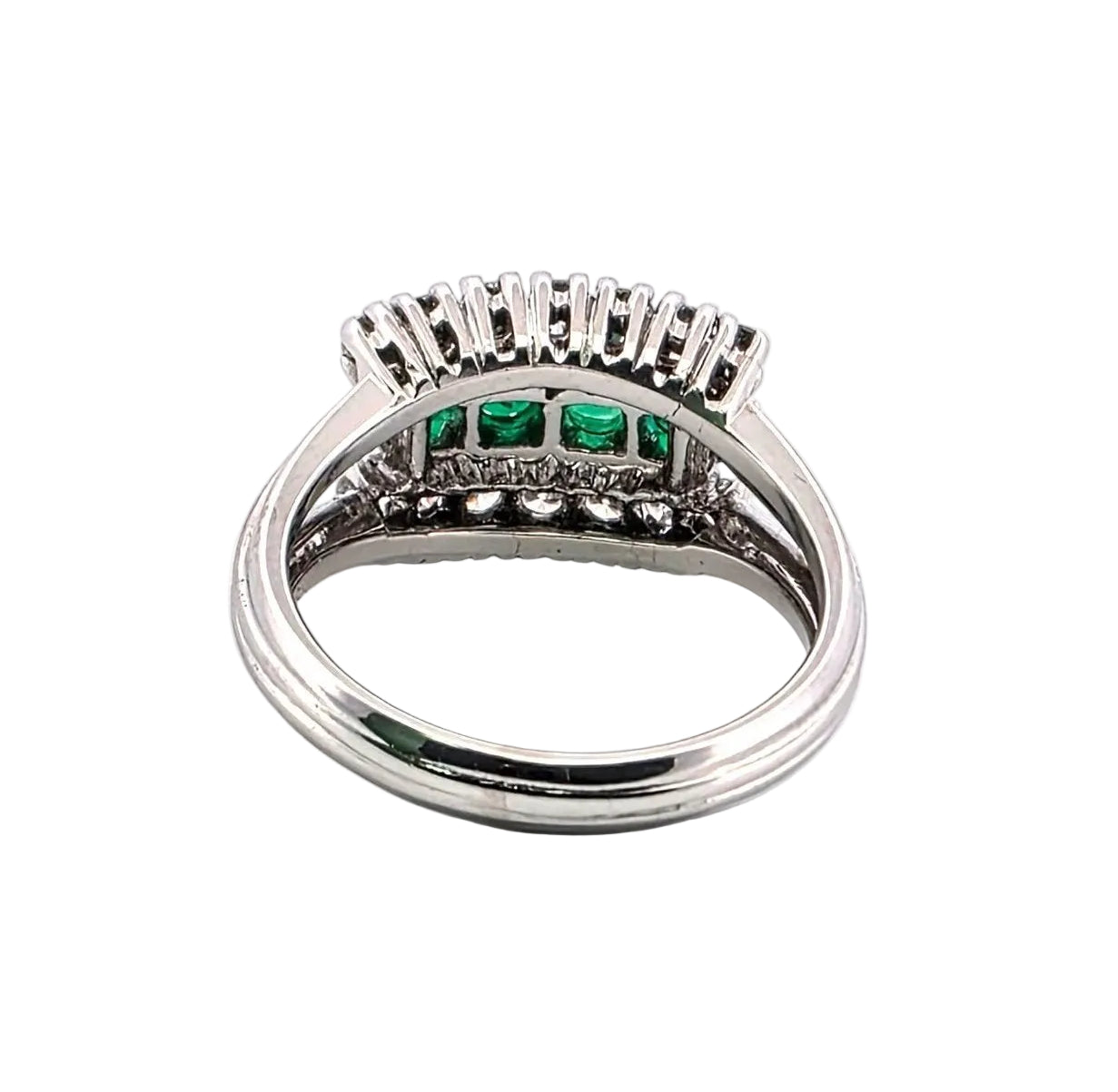 White gold ring with emeralds and diamonds