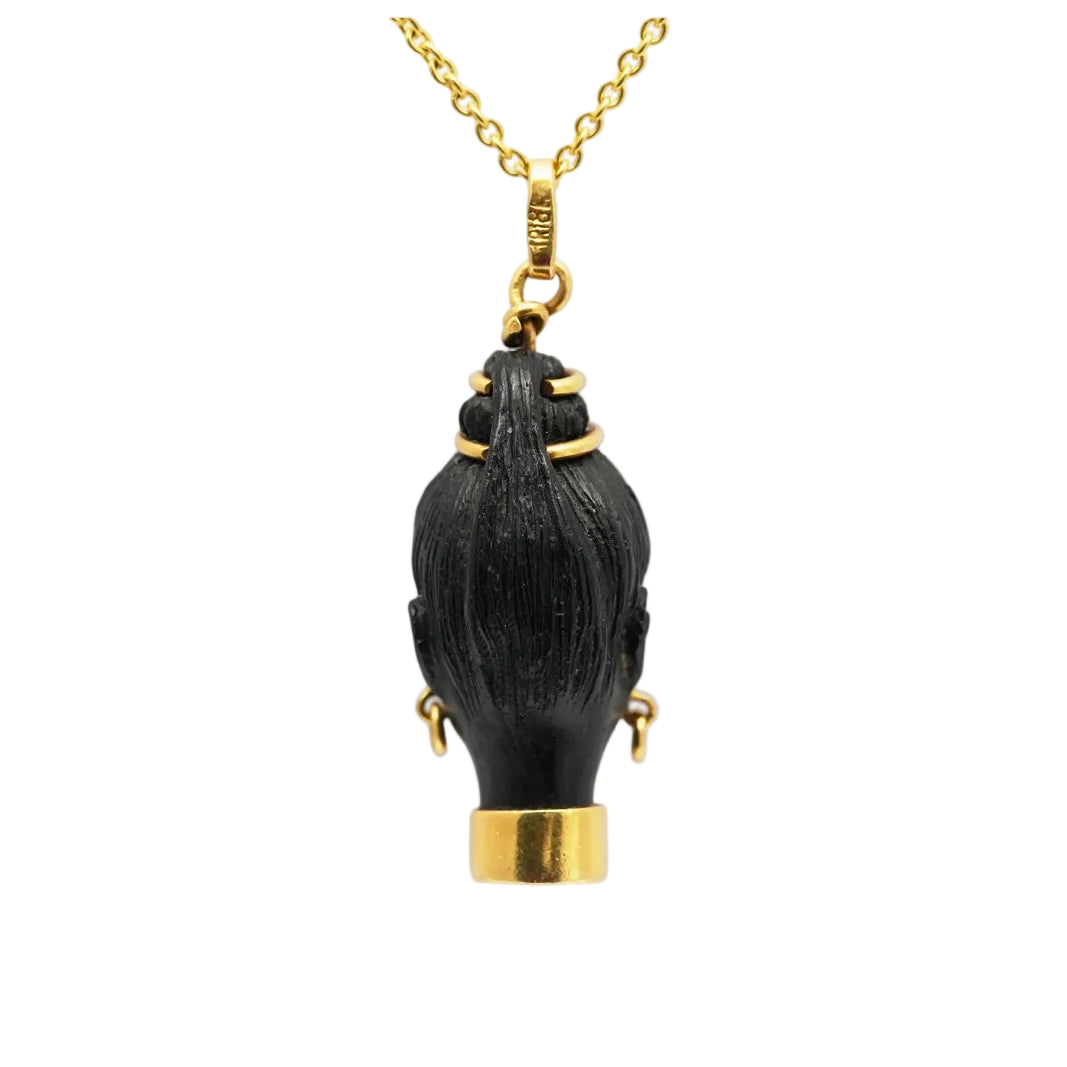 Yellow gold, ebony, and turquoise pendant