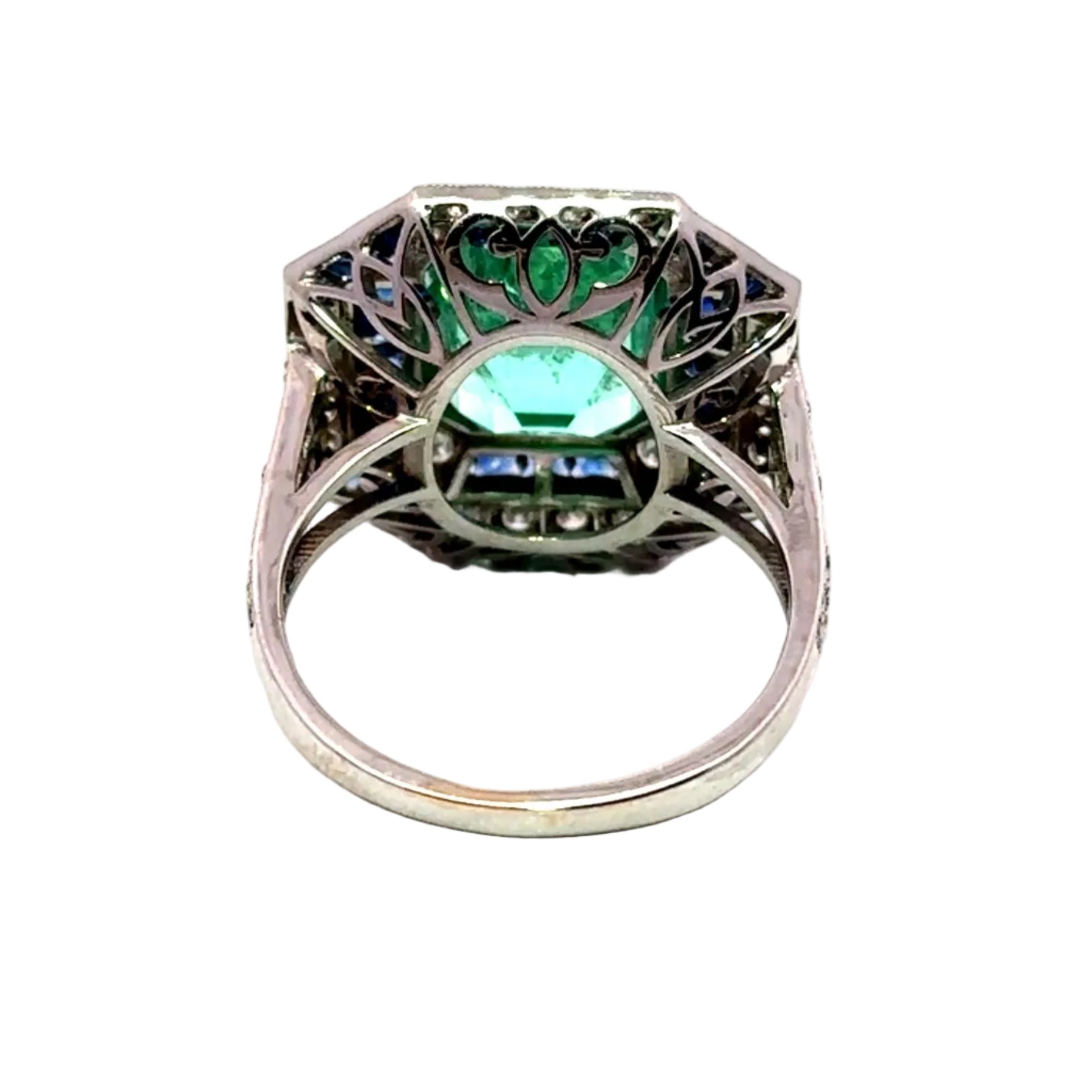Entourage Ring in white gold, emerald, sapphire, and diamonds