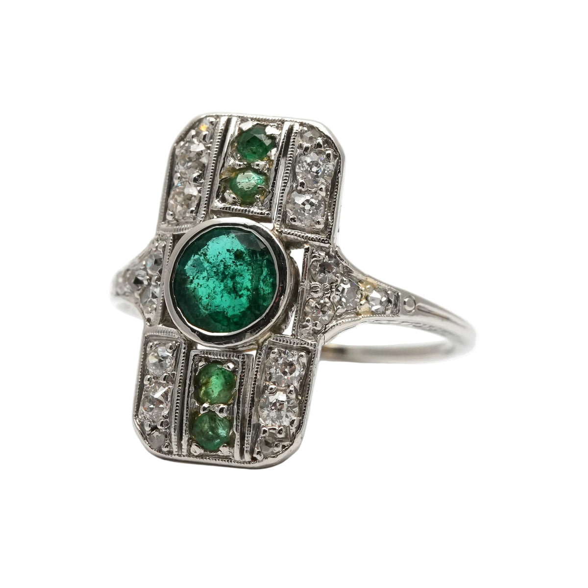 Art Deco ring in white gold, emeralds, and diamonds