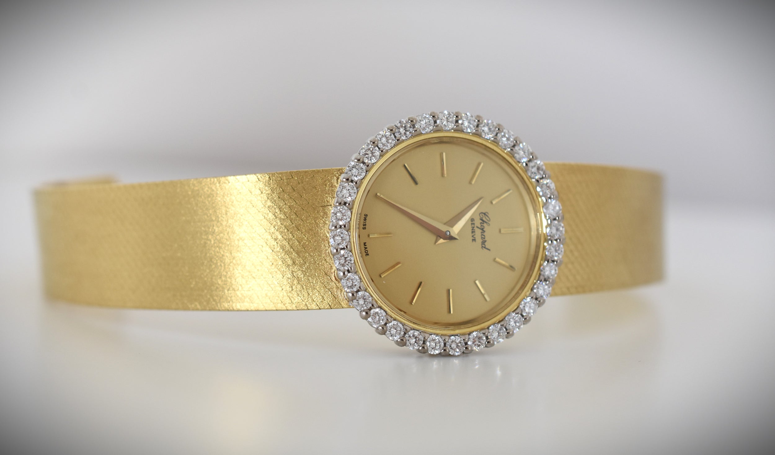 CHOPARD watch, Ref. 810, 18-carat yellow gold and diamonds, solid gold integrated bracelet, circa 1980.