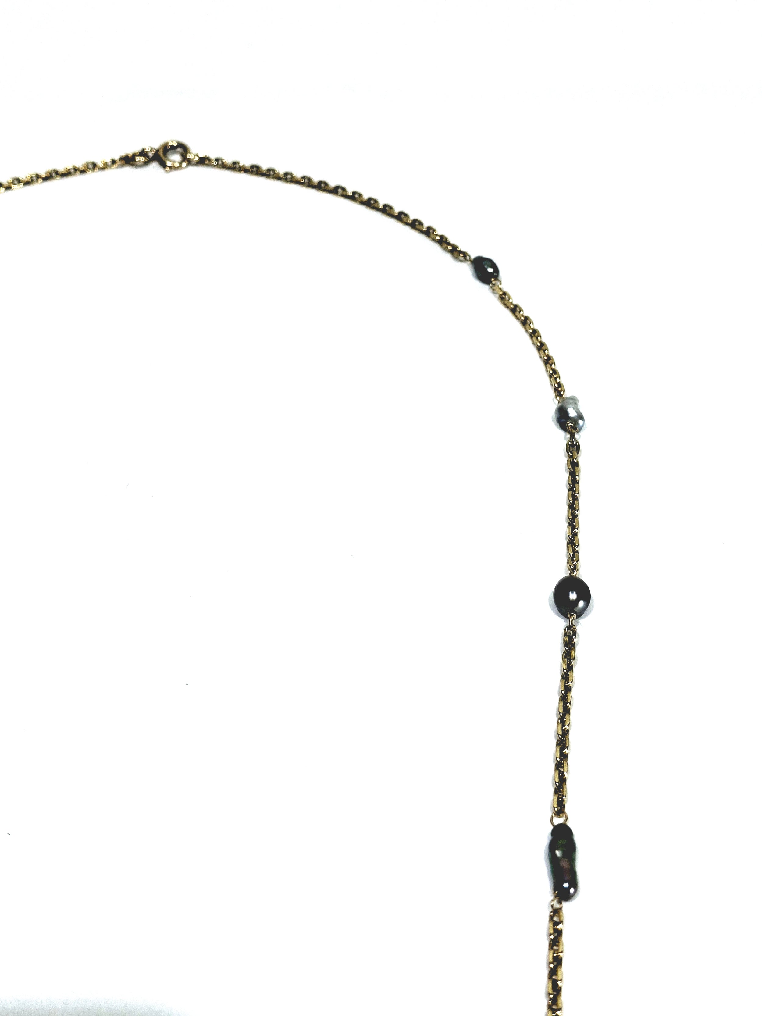 Rose gold long necklace with Tahitian pearls.