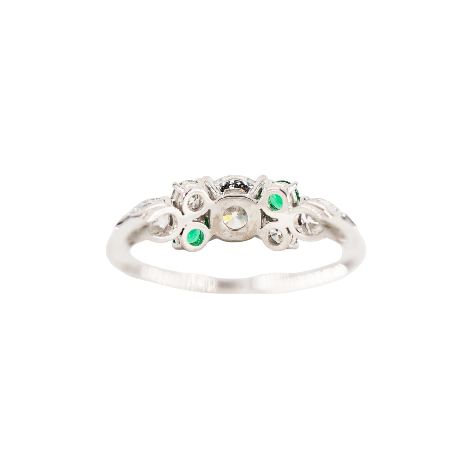 Entourage Ring in white gold, emeralds, and diamonds