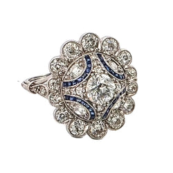 Entourage Ring in platinum, sapphires, and diamonds