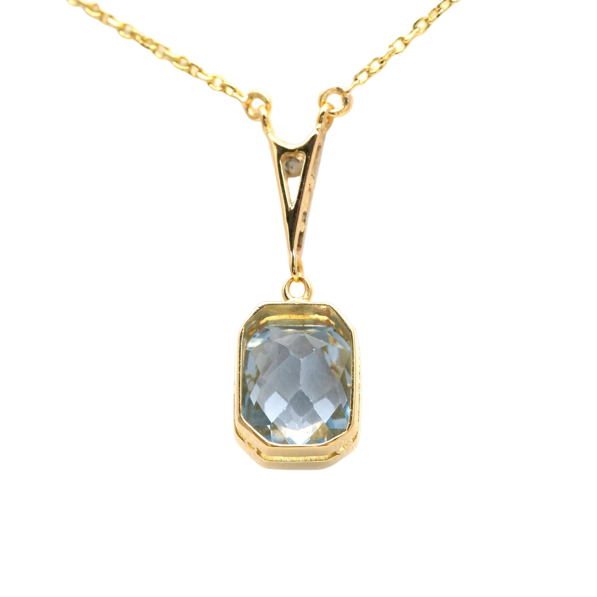 Necklace with a pendant in white gold, yellow gold, Topaz, and diamonds