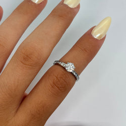 TIFFANY & CO. Solitaire Ring in Platinum and Diamonds