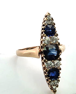 Bague Marquise en or jaune, saphirs et diamants