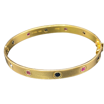 CARTIER "Love Passion" Bangle Bracelet in yellow gold, rubies, and sapphires