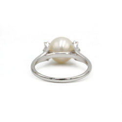 White gold ring with diamonds and a pearl