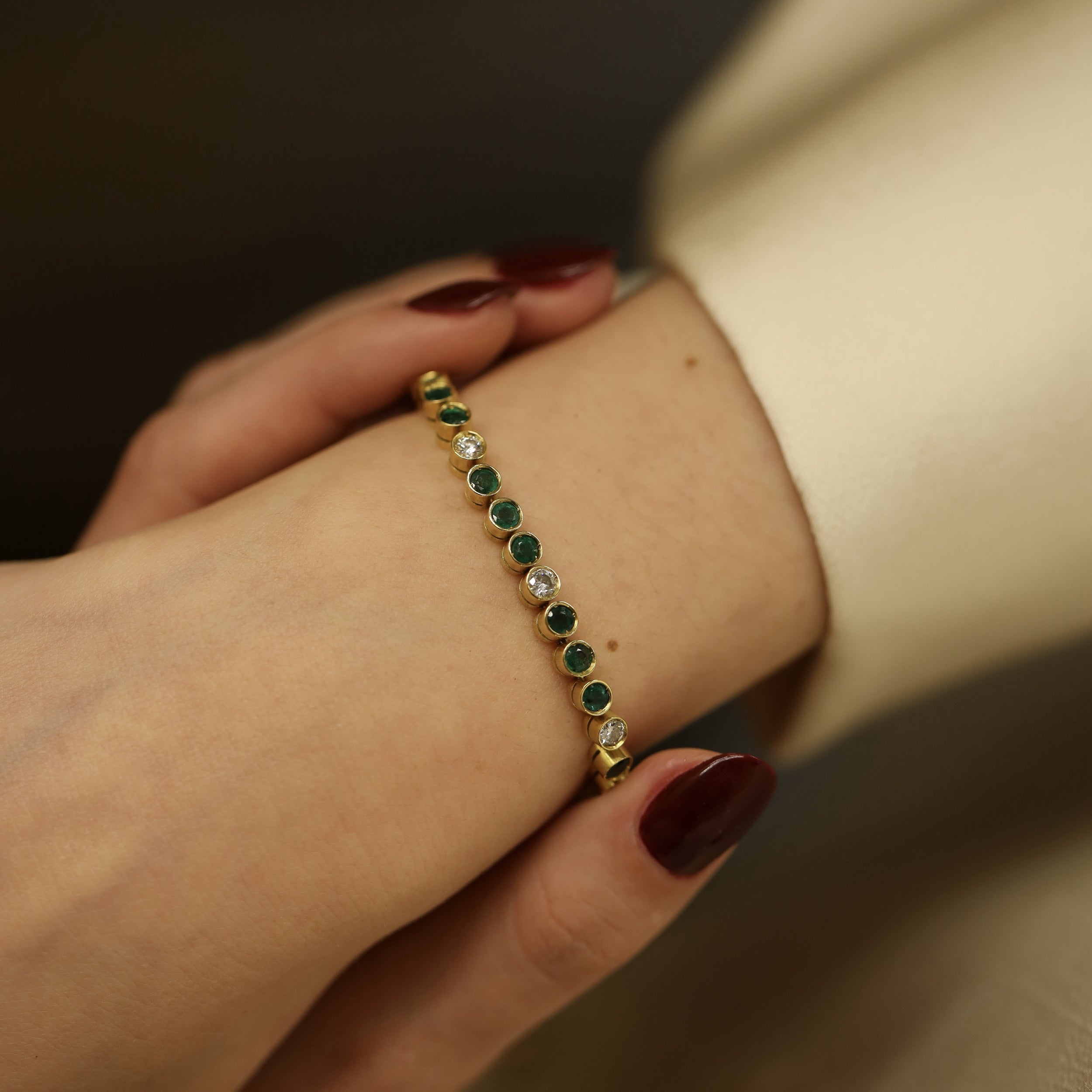 "Ligne" Bracelet in Yellow Gold, Emeralds, and Diamonds