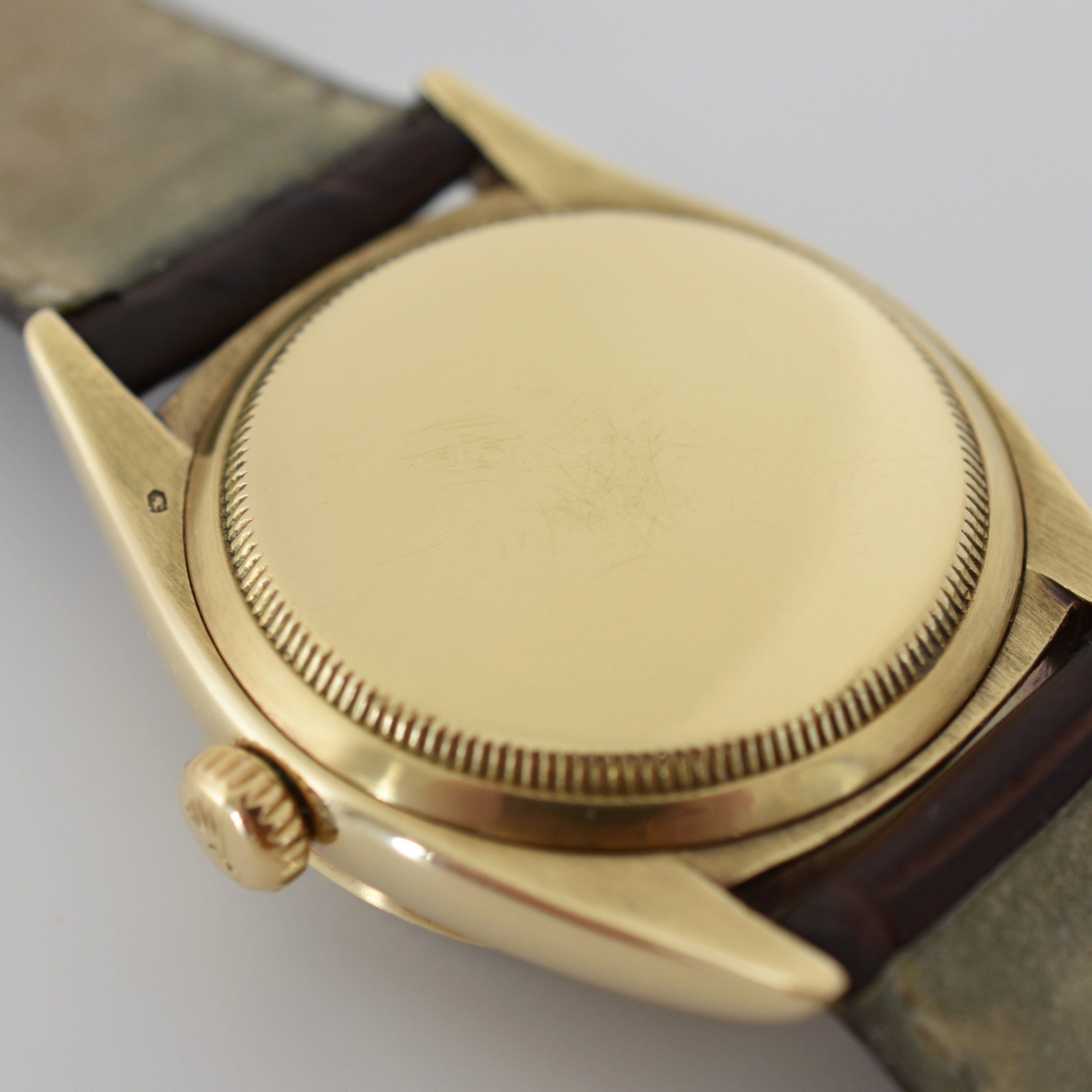 ROLEX "Oyster Perpetual Date Ovettone" watch in yellow gold and leather
