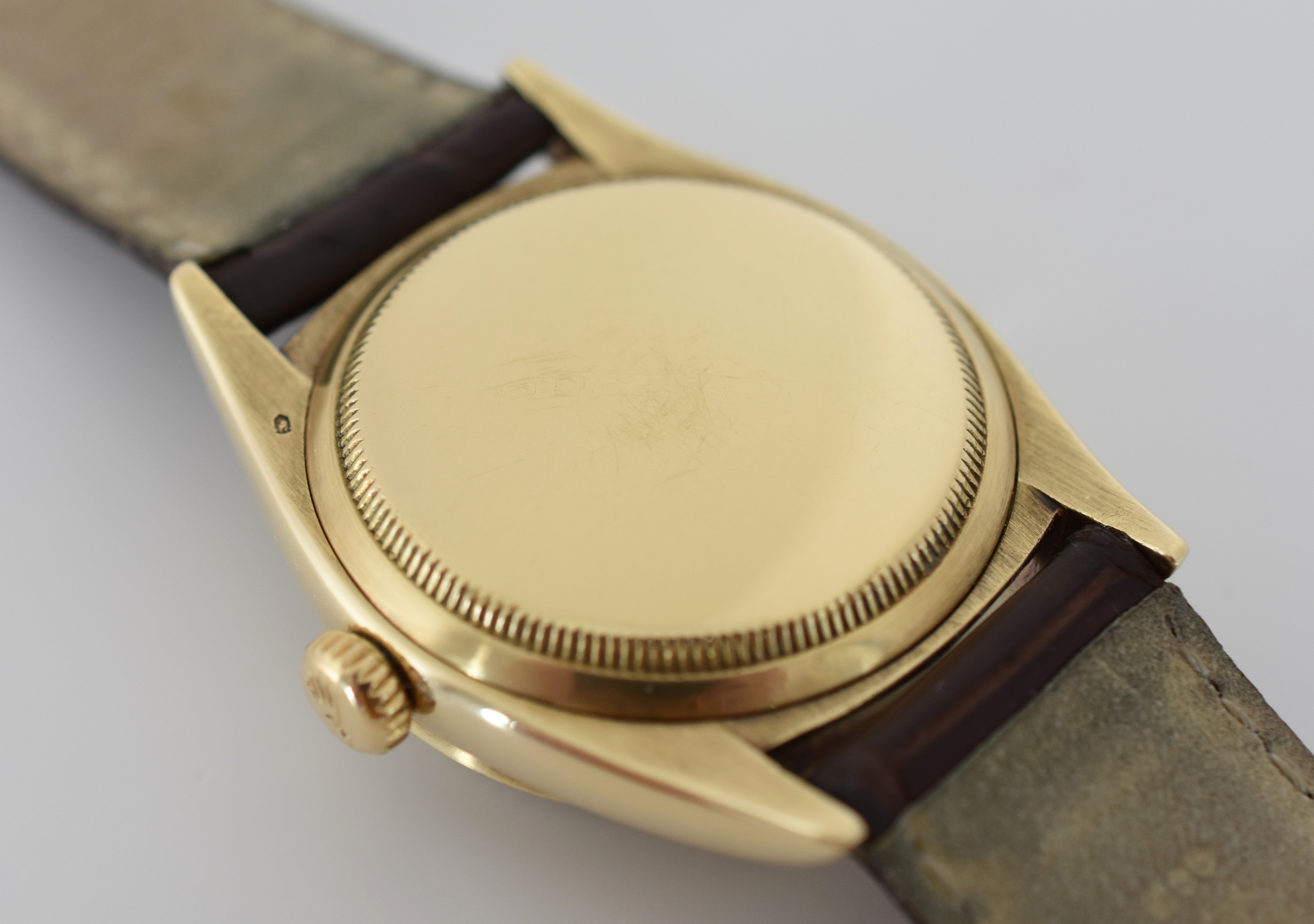 ROLEX "Oyster Perpetual Date Ovettone" watch in yellow gold and leather