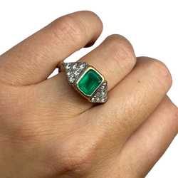 Ring in white gold, yellow gold, emerald, and diamonds