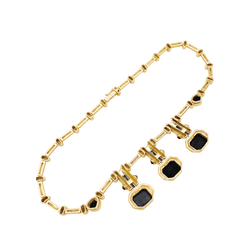 Collier or jaune, hématites pain de sucre, rubis et diamants.