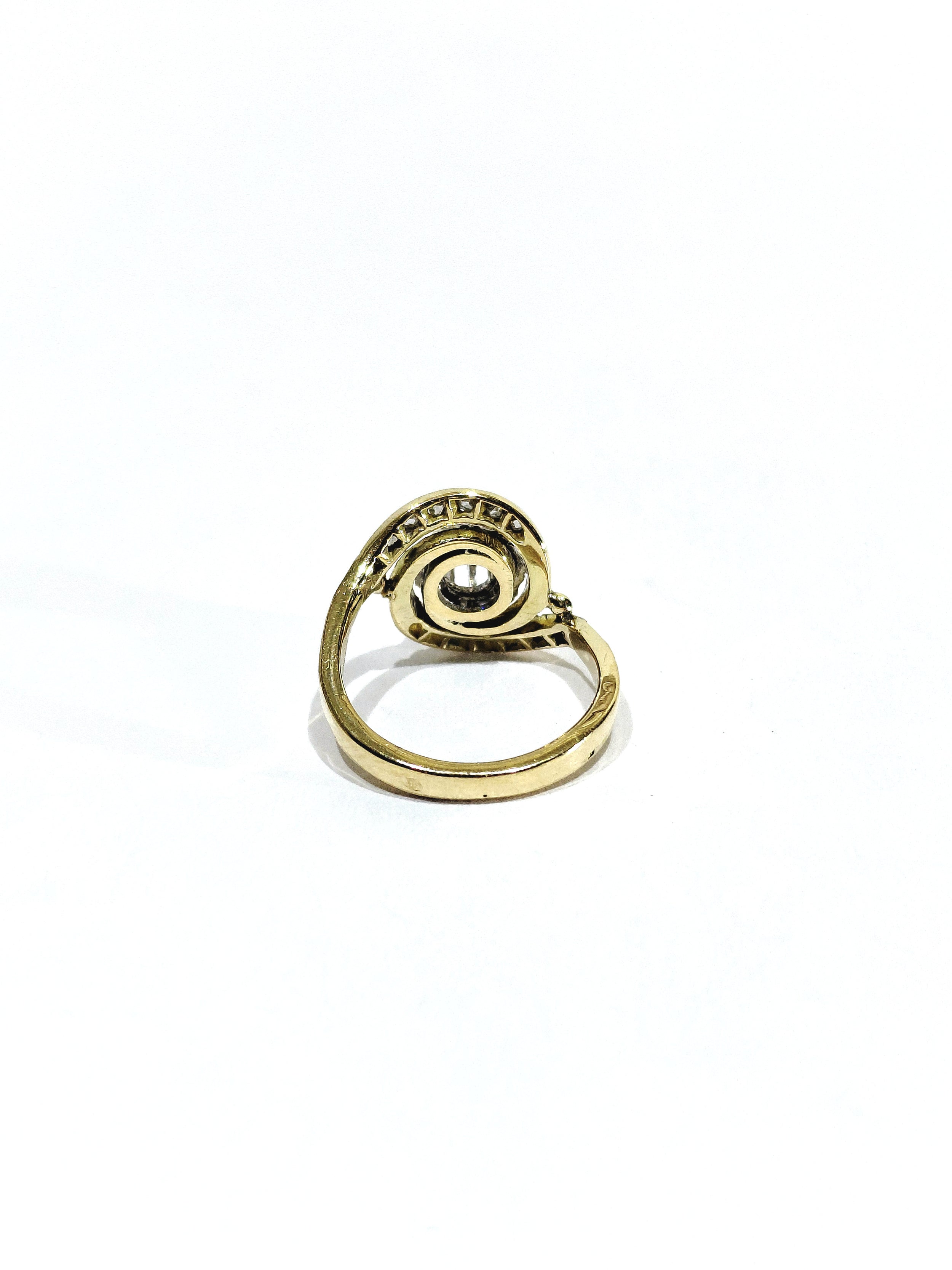 Tourbillon ring in yellow gold, white gold, and diamonds