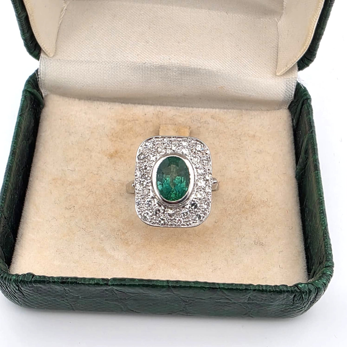 "Entourage" Ring in White Gold, Emerald, and Diamonds