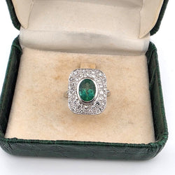 "Entourage" Ring in White Gold, Emerald, and Diamonds