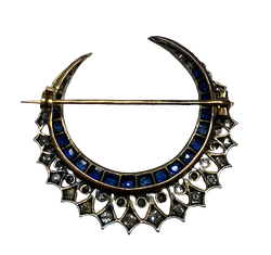 Brooch made of yellow gold, silver, sapphires, and diamonds