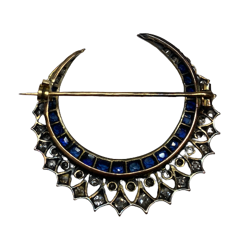 Brooch made of yellow gold, silver, sapphires, and diamonds