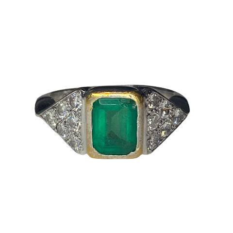 Ring in white gold, yellow gold, emerald, and diamonds