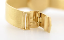 CHOPARD watch, Ref. 810, 18-carat yellow gold and diamonds, solid gold integrated bracelet, circa 1980.