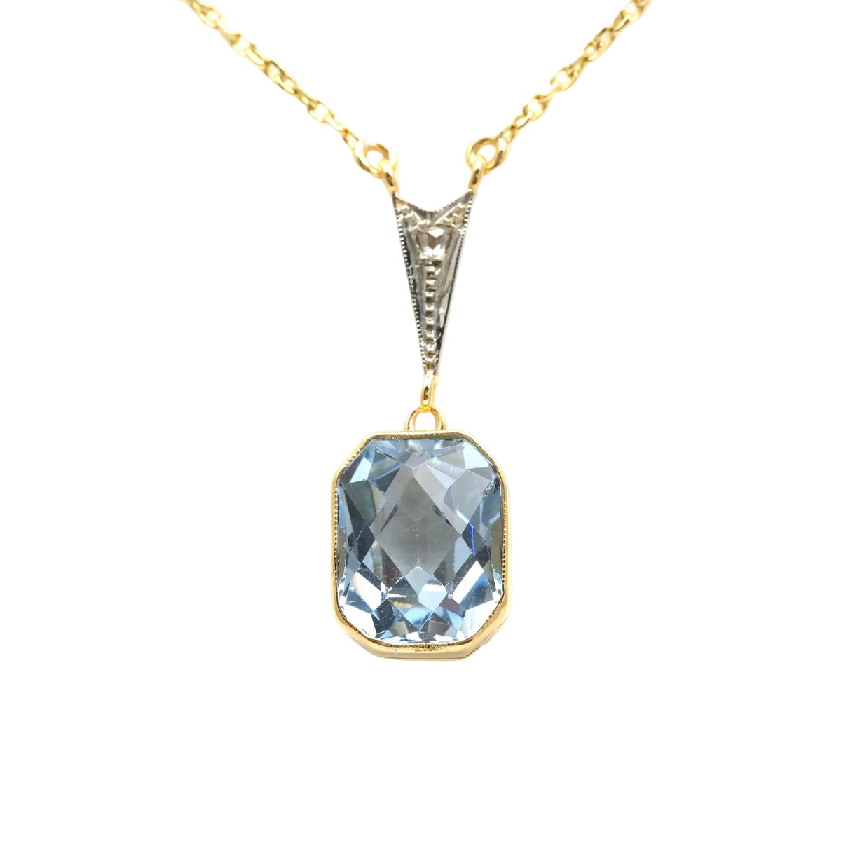 Necklace with a pendant in white gold, yellow gold, Topaz, and diamonds