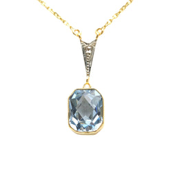Necklace with a pendant in white gold, yellow gold, Topaz, and diamonds