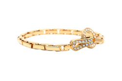 CARTIER "Agrafe" Link Bracelet in yellow gold and diamonds