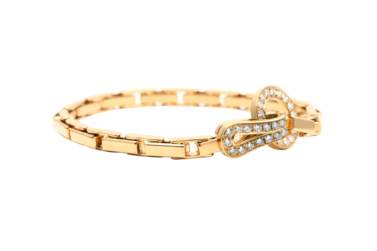 CARTIER "Agrafe" Link Bracelet in yellow gold and diamonds