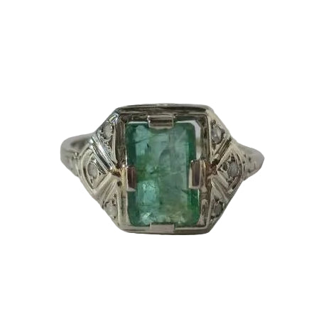 Art Deco ring in white gold, emerald, and diamonds